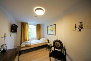 Postel nebo postele na pokoji v ubytování Liebezeit - ehemals Hotel Dillenburg