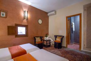 Vuode tai vuoteita majoituspaikassa Riad l'Heure d'Eté