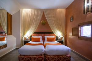 Vuode tai vuoteita majoituspaikassa Riad l'Heure d'Eté