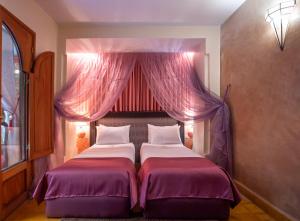 Cama o camas de una habitación en Riad l'Heure d'Eté