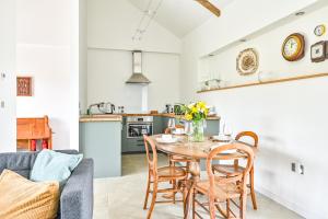 a kitchen and dining room with a table and chairs at Cosy Rural Barn with Private Garden & Forest - The Cart Barn in Tavistock