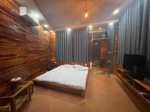 Tempat tidur dalam kamar di Xu xu motel