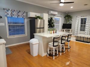 a kitchen with a kitchen island with bar stools at Just Dance in Dandridge