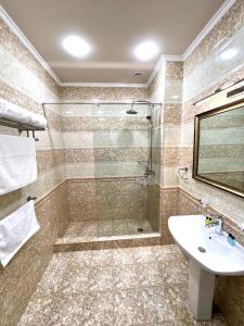 a bathroom with a shower and a sink at Your Home (YH) in Yerevan +66 photos