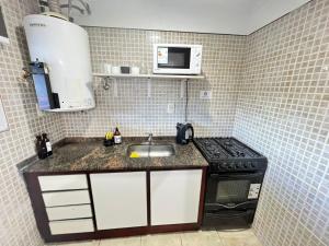 Una cocina o kitchenette en Bv colon 351 Apart Firmat 2