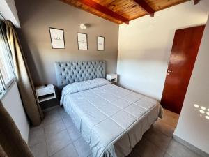 a small bedroom with a bed and a window at Bv colon 351 Apart Firmat 2 in Firmat