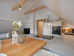 a kitchen with a wooden counter top with a refrigerator at Eden44 Top 11 in Tamsweg