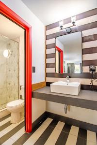 a bathroom with a sink and a mirror at The Asheville Inn in Asheville