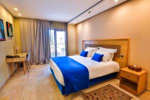 Postel nebo postele na pokoji v ubytování Hotel Cote ocean Mogador