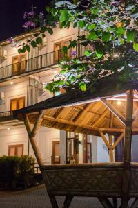 a wooden bench sitting in front of a building at Wisma Amandari in Bandar Lampung +34 photos