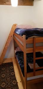 a set of bunk beds in a room at Mirni kutak in Donje Pazarište