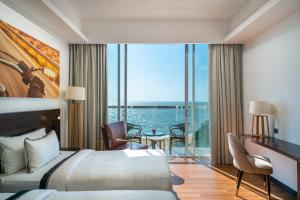 Postel nebo postele na pokoji v ubytování Regal Réseau Hotel & Spa