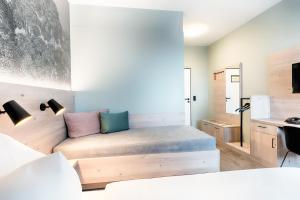 Postel nebo postele na pokoji v ubytování Hotel Sachsen-Anhalt