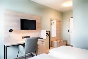TV a/nebo společenská místnost v ubytování Hotel Sachsen-Anhalt