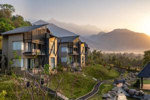 an image of a resort with mountains in the background at Norbu The Montanna, Dharamshala - IHCL SeleQtions in Dharamshala