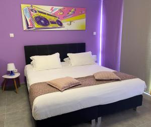 Ένα ή περισσότερα κρεβάτια σε δωμάτιο στο Connect Suites