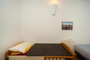 a small room with a bed and a table at Casa Colina in Albir +20 photos