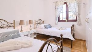 Posteľ alebo postele v izbe v ubytovaní Villa Bellissima + 32 fotografií