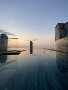 a view of a pool in a city with buildings at Kua Casa Suite in Da Nang