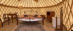 A bed or beds in a room at Öko Kemping és Glamping Tiszadada