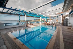 a swimming pool on the deck of a cruise ship at Blue Waves View in Batsi