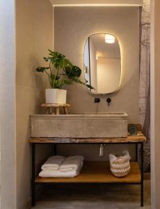 a bathroom with a sink and a mirror at la posada de consuelito in Chiloeches
