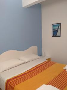 A bed or beds in a room at Albergo Belvedere
