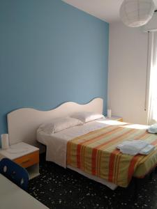A bed or beds in a room at Albergo Belvedere