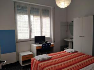 A bed or beds in a room at Albergo Belvedere