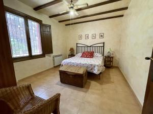 A bed or beds in a room at Casa Ramoncico. Finca el Campillo