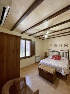 A bed or beds in a room at Casa Ramoncico. Finca el Campillo