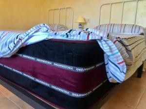 A bed or beds in a room at Casa Ramoncico. Finca el Campillo