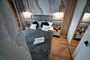 Postel nebo postele na pokoji v ubytování Boutique 62 by Housine
