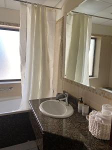 a bathroom with a sink and a mirror at 1 Bedroom in Jumeirah Beach Residence Dubai in Dubai