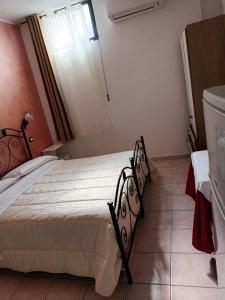 Postel nebo postele na pokoji v ubytování Il Rifugio dell'Ape Agriturismo