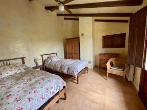A bed or beds in a room at Casa Ramoncico. Finca el Campillo