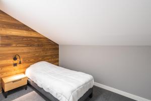 Postel nebo postele na pokoji v ubytování Vacancéole - Les Ecrins d'Auris