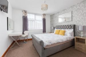 Posteľ alebo postele v izbe v ubytovaní Beachcliffe Lodge Apartments