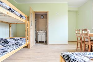Postel nebo postele na pokoji v ubytování Farma Serock