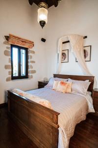 מיטה או מיטות בחדר ב-Your-Villa, Villas in Crete