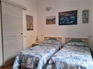 Giường trong phòng chung tại La Finestra Vista Corsica