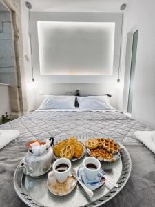 Ένα ή περισσότερα κρεβάτια σε δωμάτιο στο La Curia