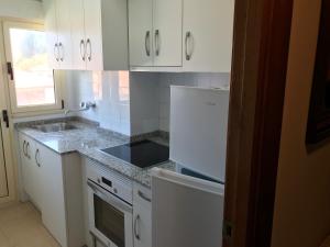 Kuchyň nebo kuchyňský kout v ubytování Apartamento en La Isla Colunga