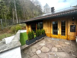 a house with a patio in front of it at Fewo Ziemer 2 in Piding