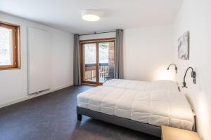 Postel nebo postele na pokoji v ubytování Vacancéole - Les Ecrins d'Auris
