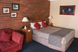 Postel nebo postele na pokoji v ubytování Bendigo Haymarket Motor Inn