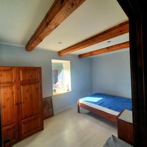Postel nebo postele na pokoji v ubytování ApartmentApsuciems