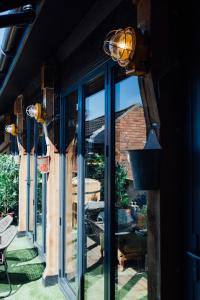 a glass door with a view of a patio at Destinesia Jason Works in Loughborough