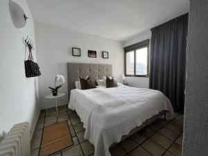 Posteľ alebo postele v izbe v ubytovaní Ático espectacular en primera línea playa con piscina + 18 fotografií