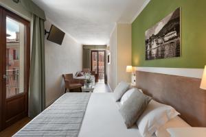 Voodi või voodid majutusasutuse Hotel Garni Corona toas